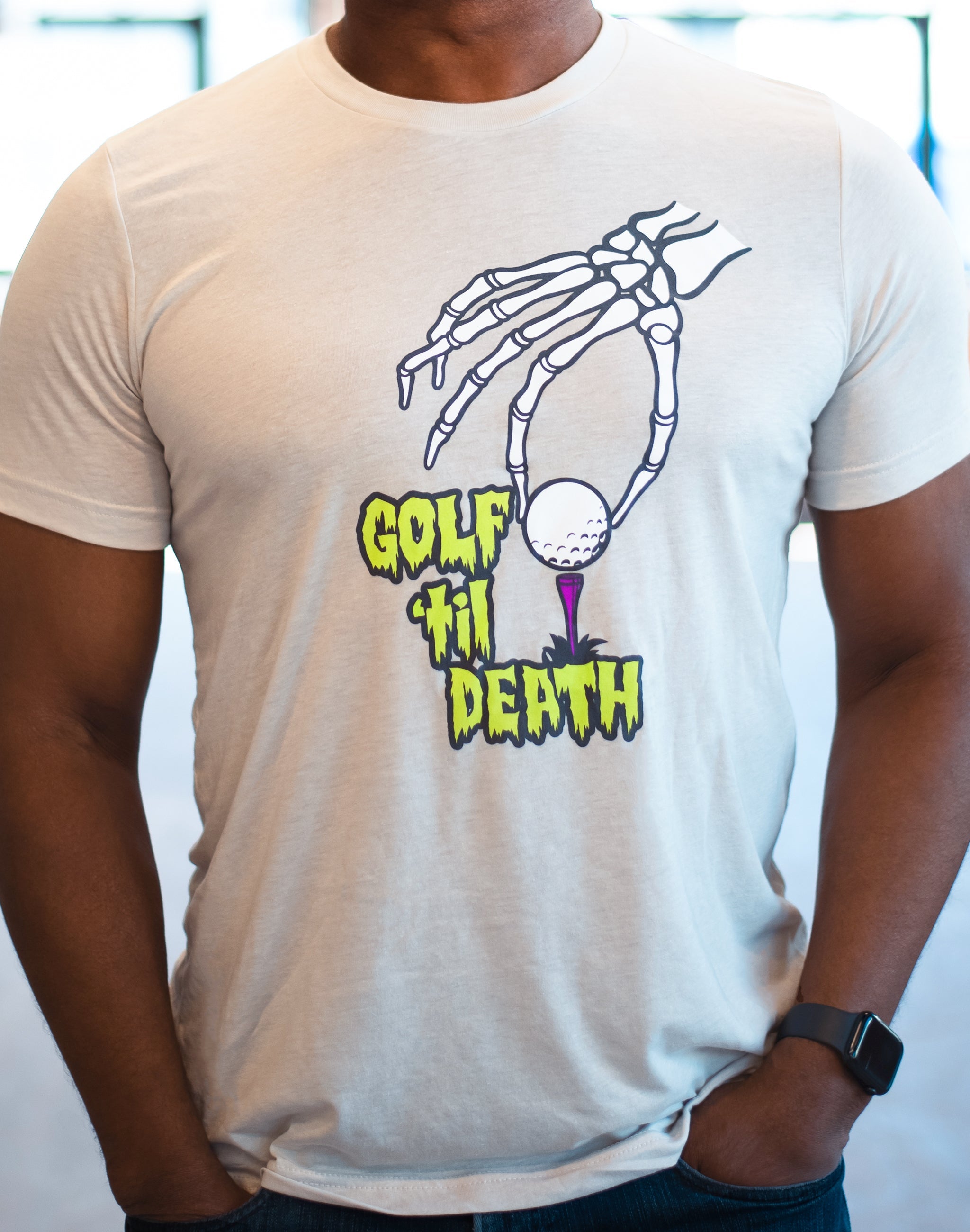 https://www.gun-ammo.com/wp-content/uploads/A0004/gunsphoto-2/mancaveandapparel-1/1-swingjuice-golf-til-death-unisex-short-sleeve-tee-front-guy-cement.jpg